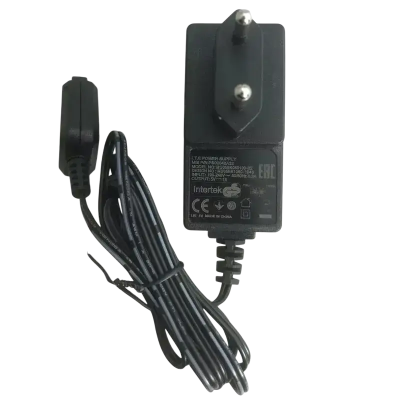 Black plastic wall charger with coiled cord and european plug for motorola tetra radio use