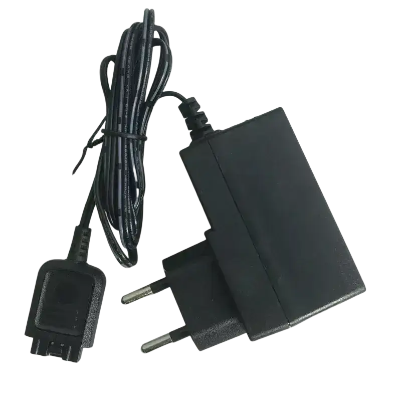 Black plastic wall charger with coiled power cord and european plug for motorola tetra radio