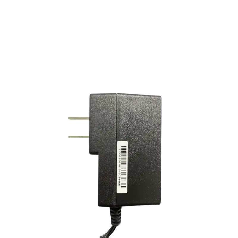 Black plastic wall charger with two-prong plug and coiled cable for motorola tetra radio power supply