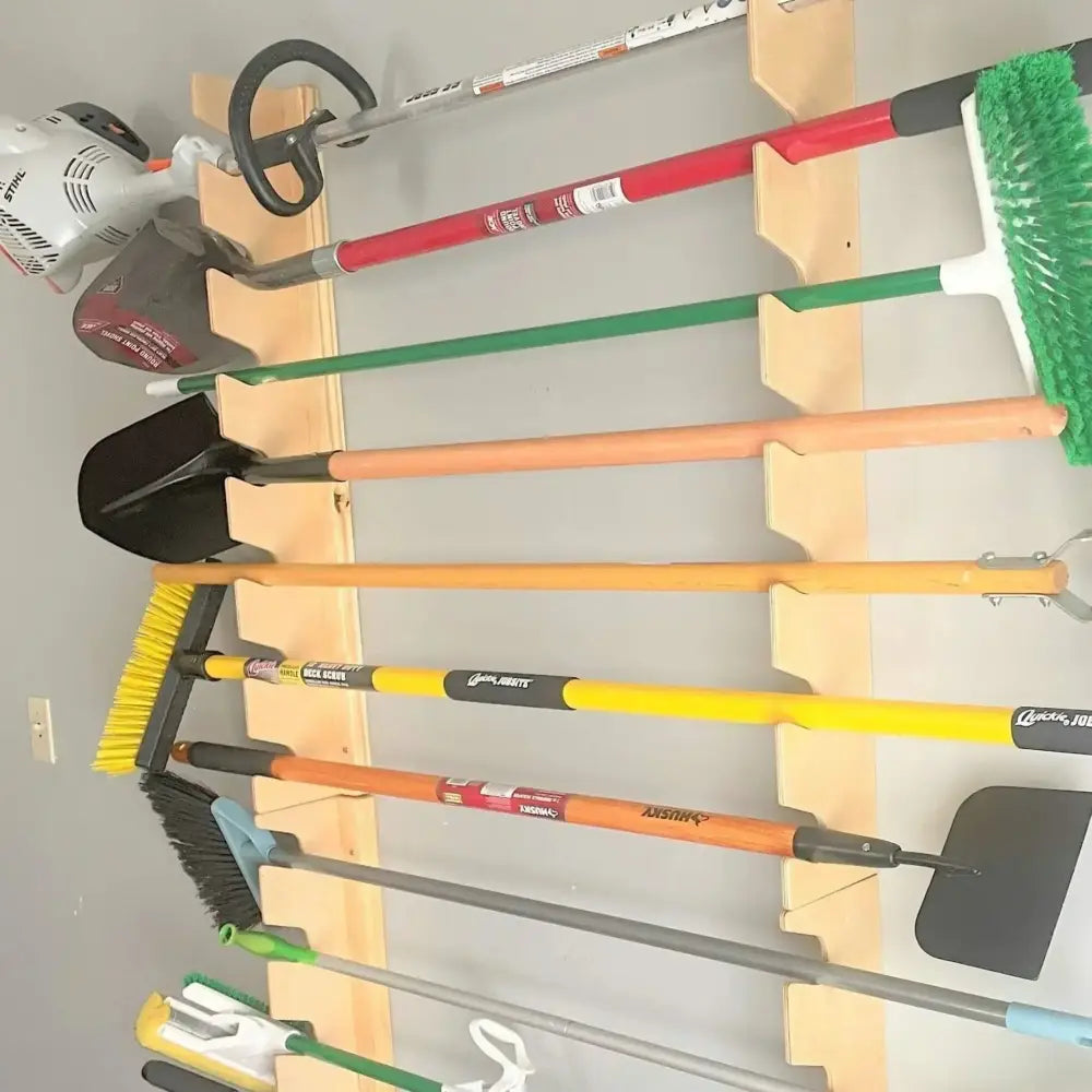 Lancaster wooden wall mounted garden tool and shovel rack holding colorful handle tools with black metal heads