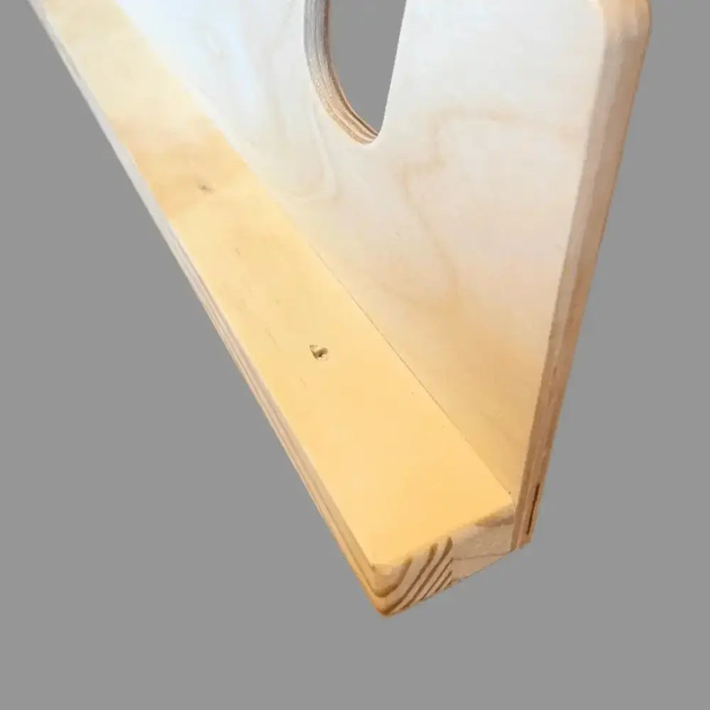 Lancaster wooden wall mounted garden tool and shovel rack light-colored wood shelf with circular cutout and visible grain