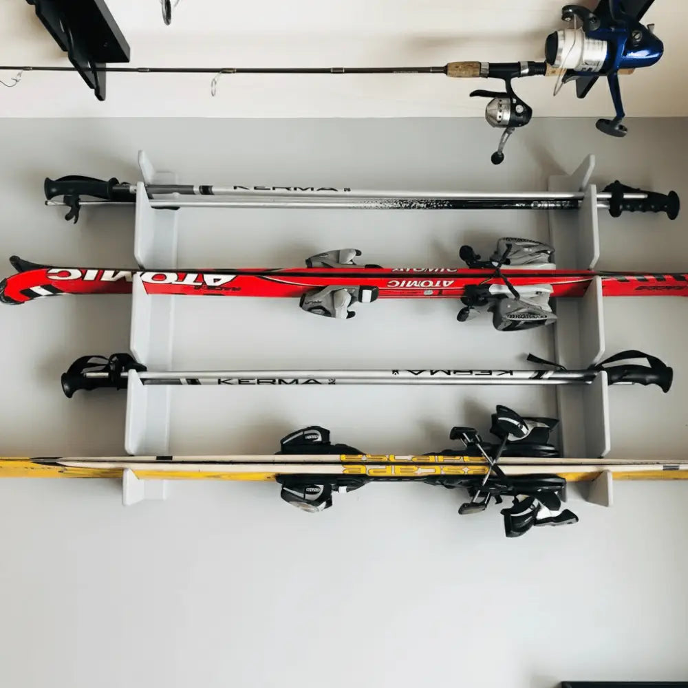 White birch plywood wall mounted ski rack holding four pairs of skis and poles for organized storage