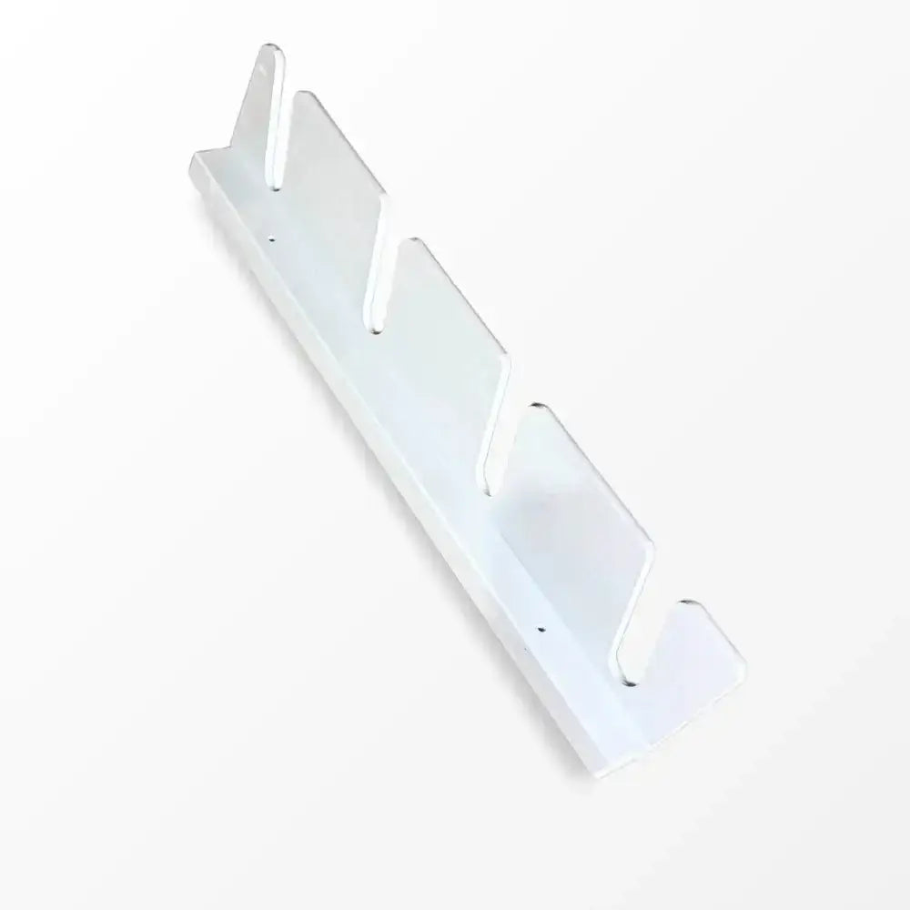 White plastic wall-mounted hook rack with three curved hooks for organizing skis and poles on birch plywood wall mount
