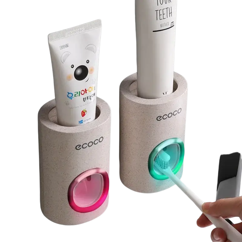 Beige textured wall mounted toothpaste dispenser and holder set with pink and green illuminated openings for bathroom use