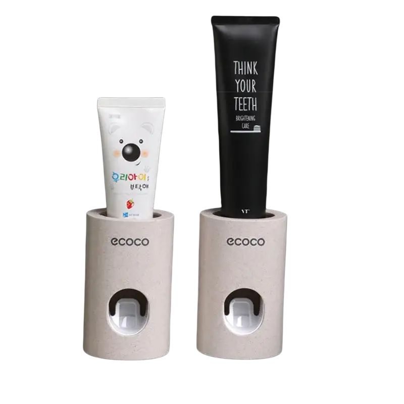 Beige textured wall mounted toothpaste dispensers with ecoco branding in a wall mounted toothpaste dispenser and holder set