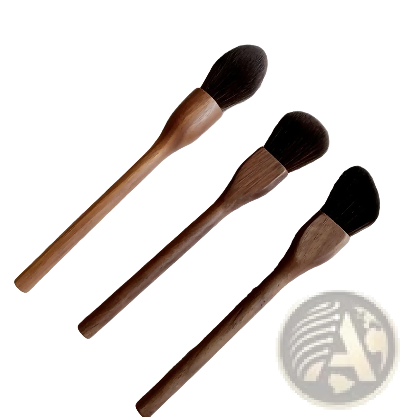 Set of three walnut wood makeup brushes with soft dark brown fiber bristles and wooden handles