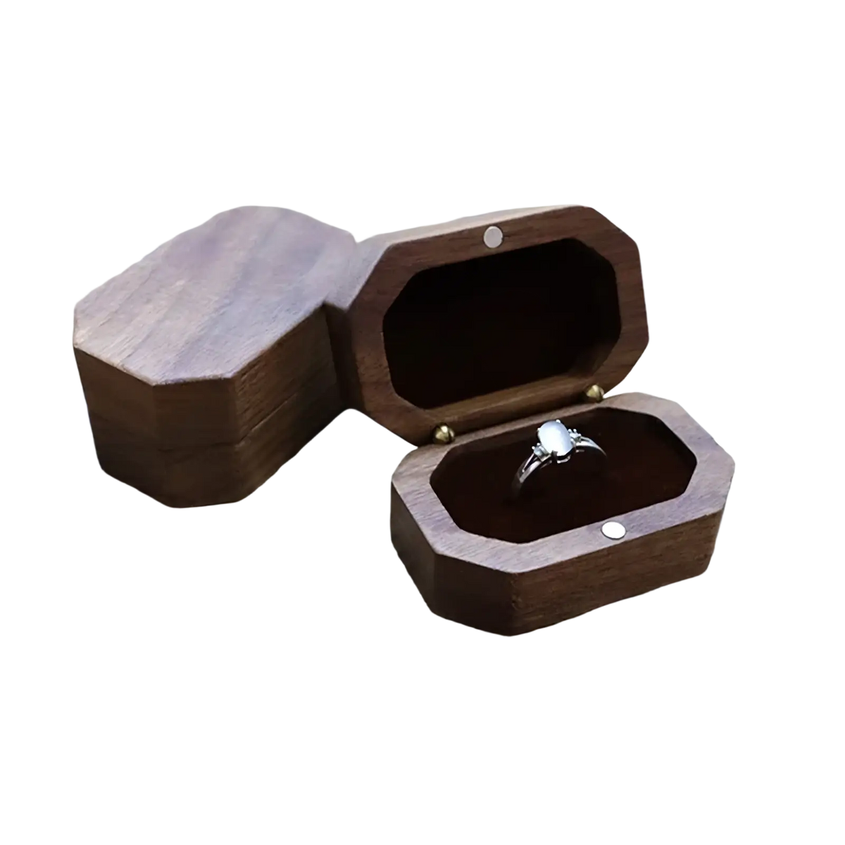 Dark brown wooden octagonal walnut wood engagement ring box with a silver toned ring inside