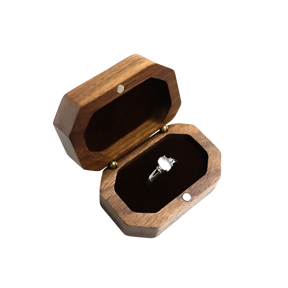 A sleek dark brown walnut wood octagonal engagement ring box with a silver toned ring inside