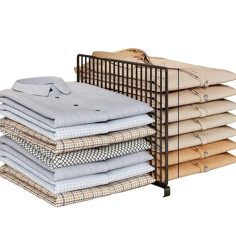 Black metal wire wardrobe divider organizer with vertical grid design holding folded shirts in various colors and patterns