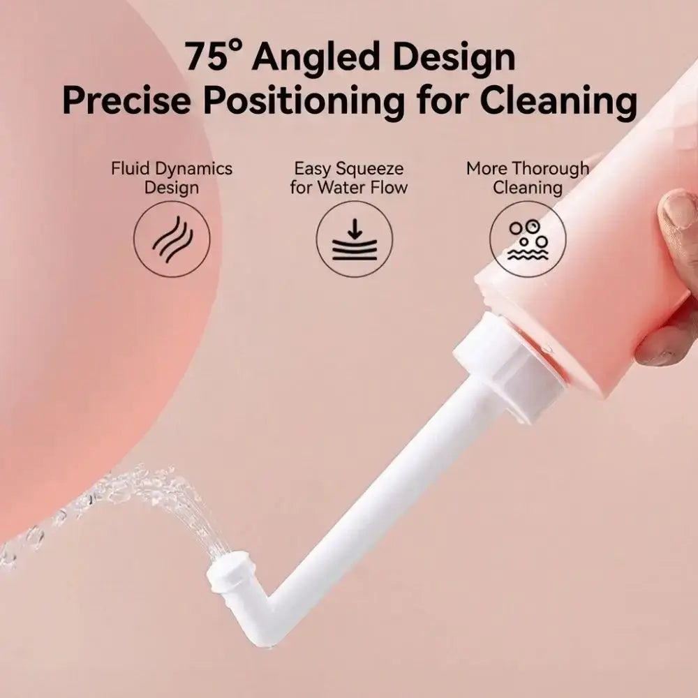 Pink plastic easy squeeze wash bottle with white angled nozzle for precise postpartum peri bottle cleaning