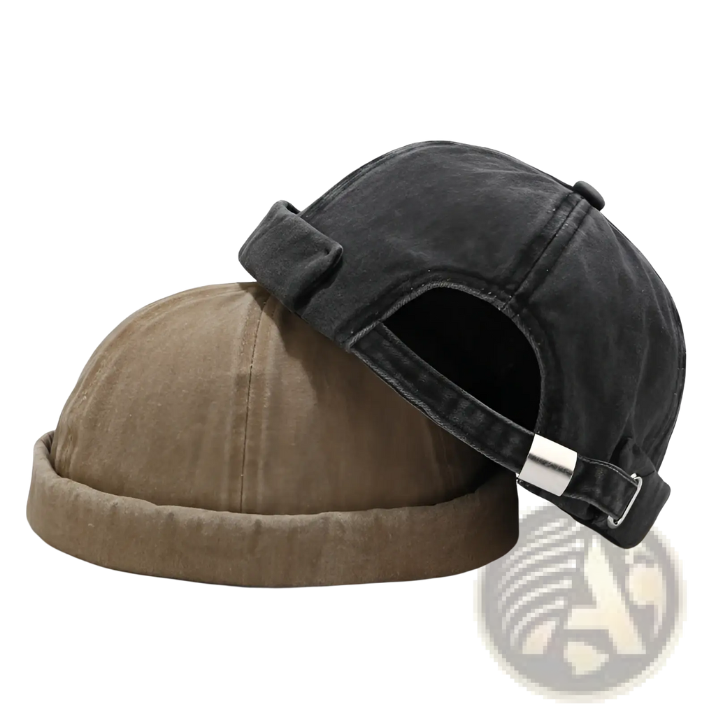 A dark gray washed denim baseball cap with a retro rolled brim and silver buckle closure
