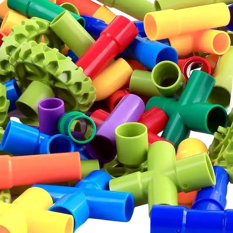 A vibrant pile of colorful plastic water building blocks connectors in red blue green yellow and purple for diy water building