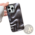 The back side of a sleek glossy black water ripple iPhone case with a fluid wave pattern and subtle silver highlights