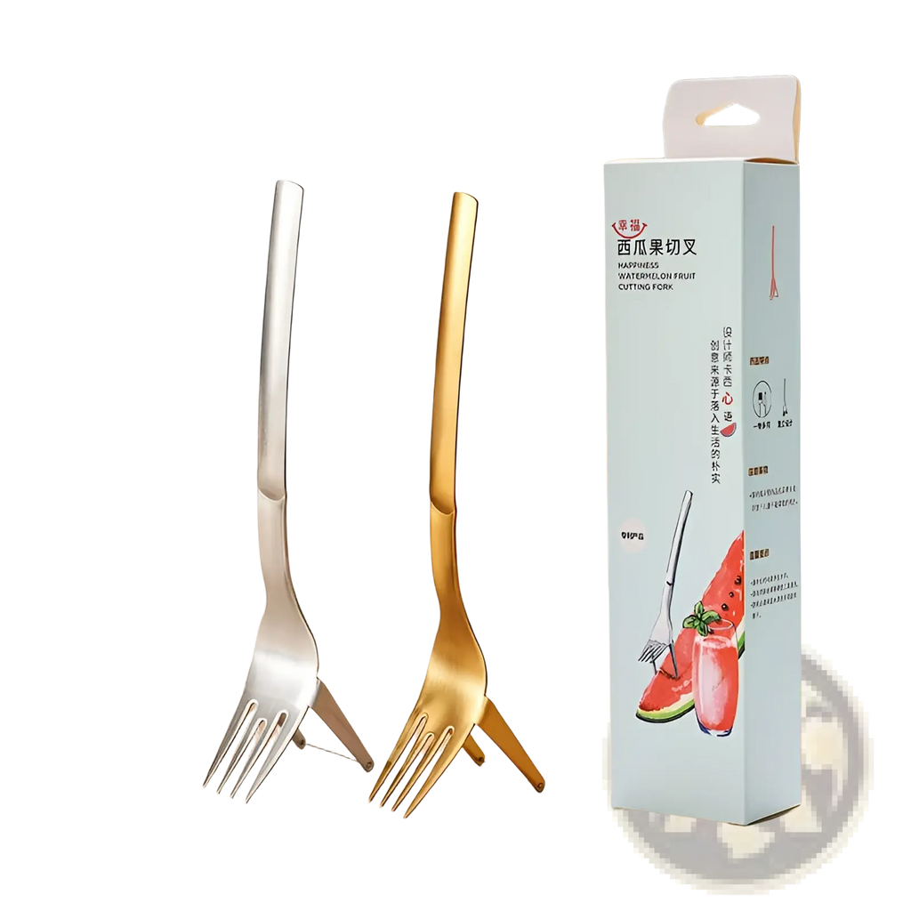 Two sleek metallic watermelon slicer forks in silver and gold stainless steel beside packaging on wooden surface