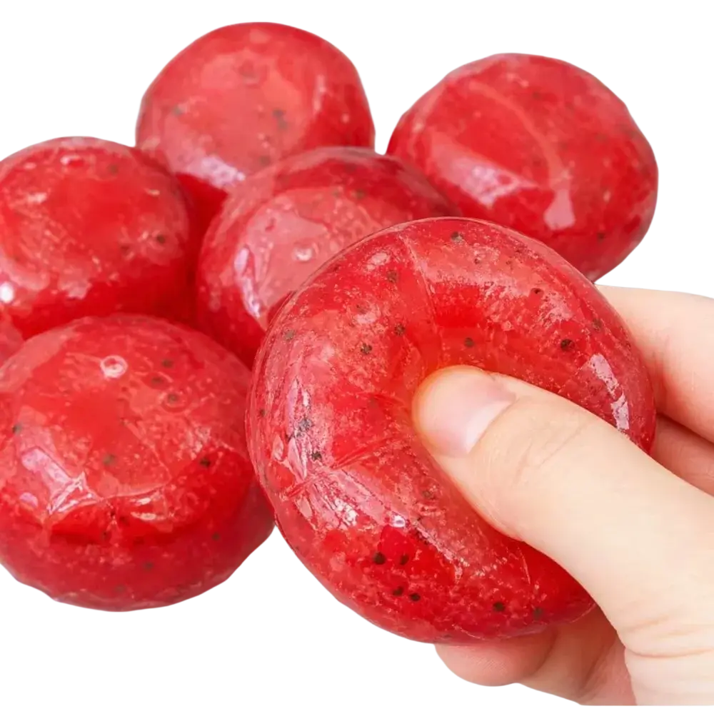 Red translucent handmade watermelon slush slow rebound stress relief toy shaped like a strawberry with black seeds