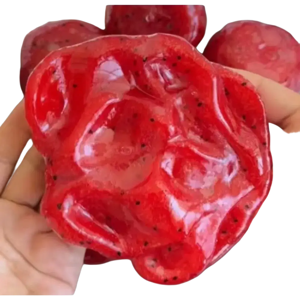 Handheld vibrant red slow rebound watermelon slush stress relief toy with glossy skin and black seeds, handmade watermelon design
