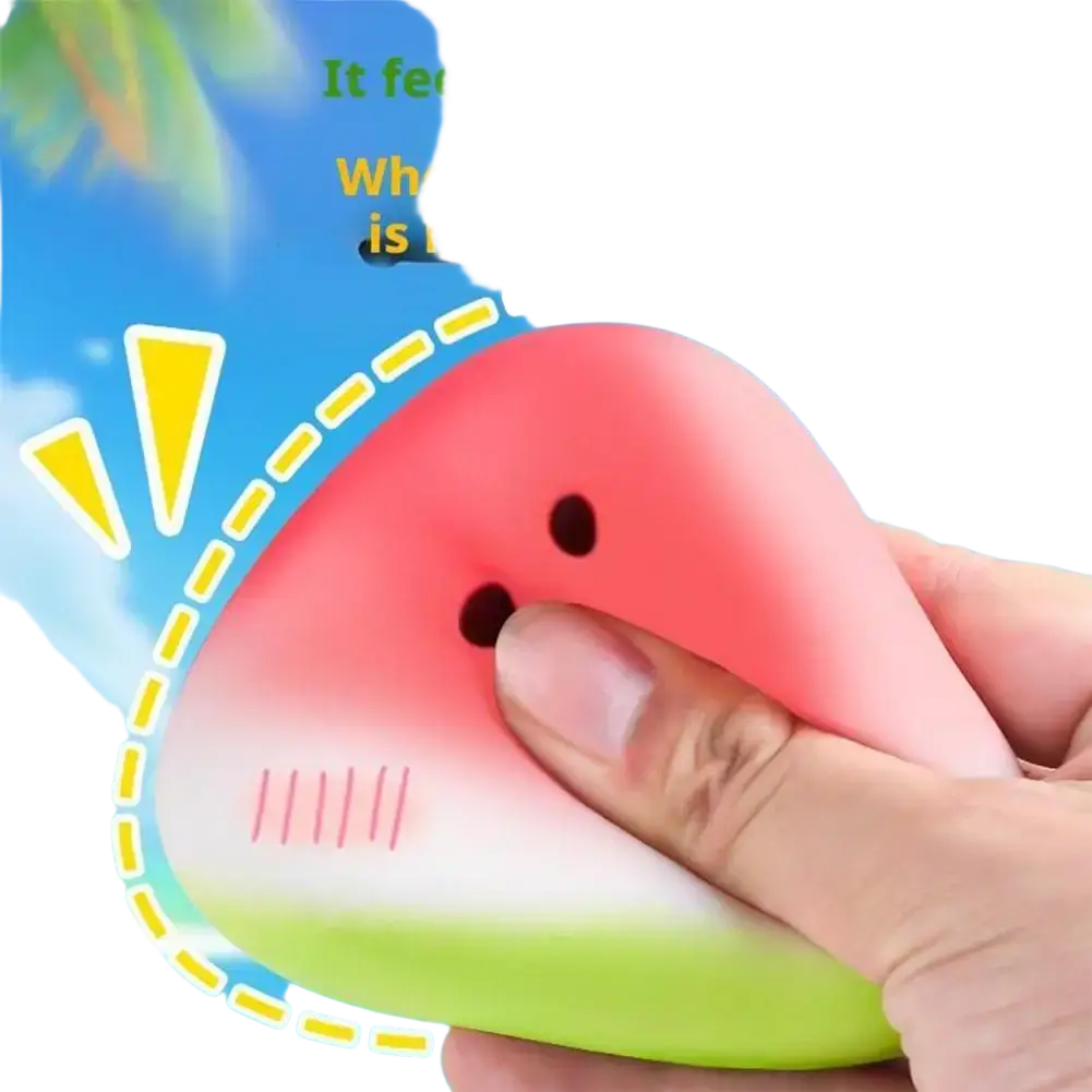 Pink and green watermelon-shaped squeeze toy with black dot eyes and smiling mouth slow rising stress reliever