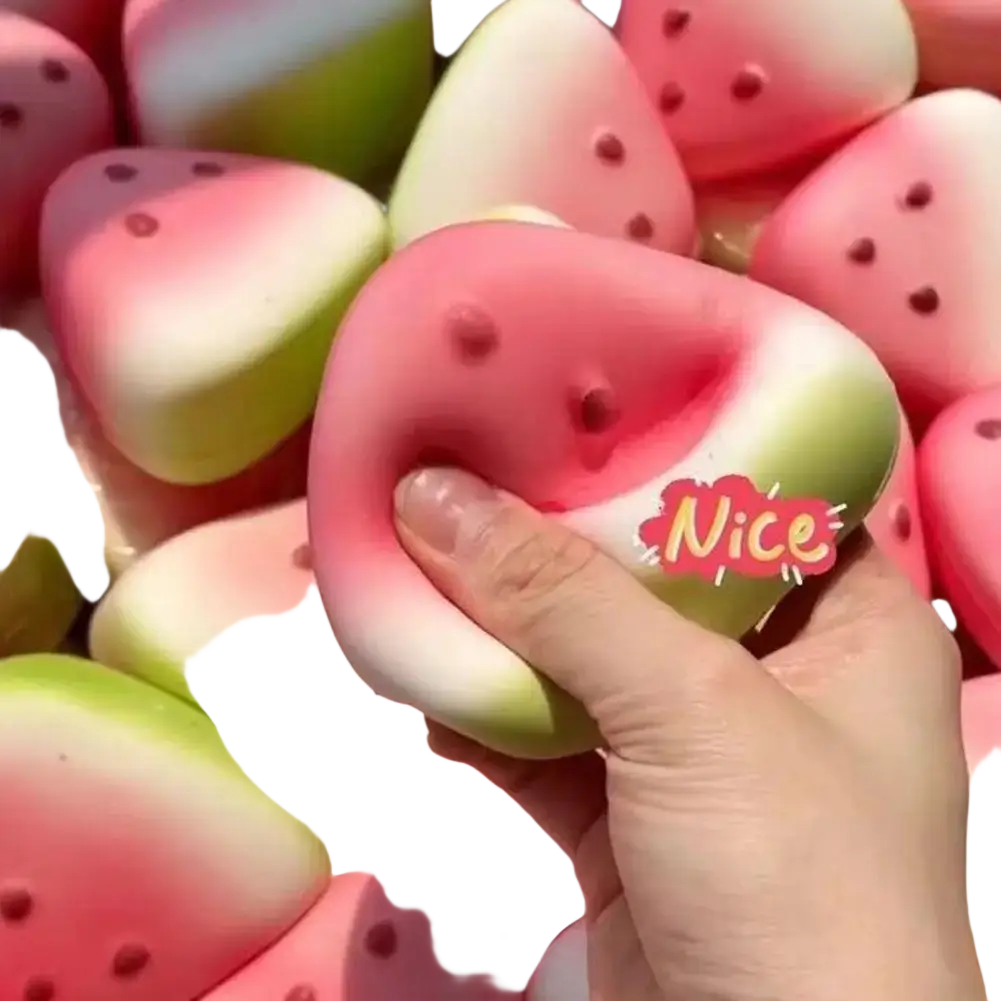 Pink and green watermelon-shaped slow rising squeeze toy with black seed details for sensory stress relief