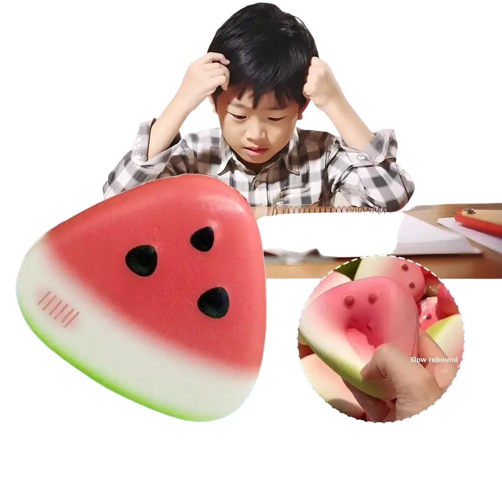 Red and green watermelon-shaped slow rising squeeze toy stress ball with black seed details for sensory relief