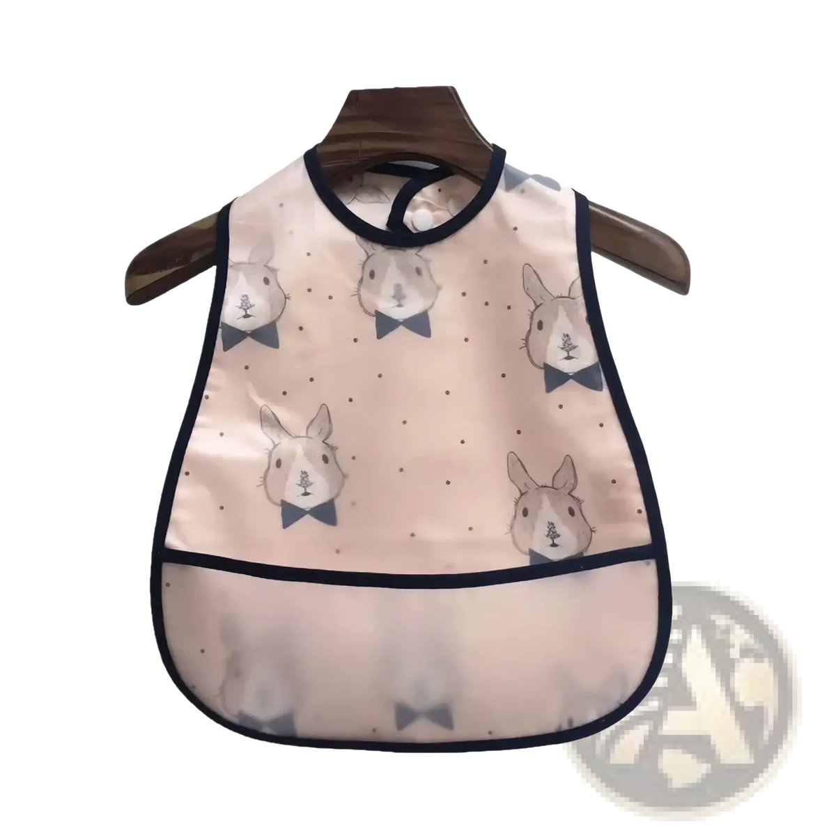 Waterproof baby bib made of eva in pink with navy blue trim and cartoon rabbits for feeding use