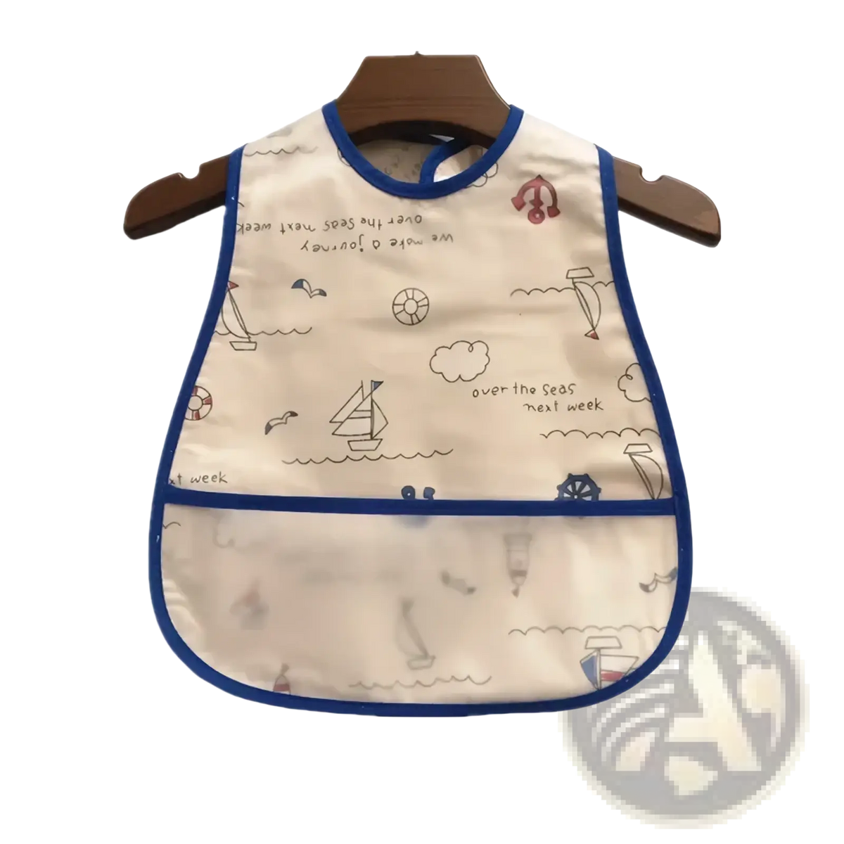 Cream-colored waterproof baby bib with blue trim and nautical sailboat illustrations for feeding protection