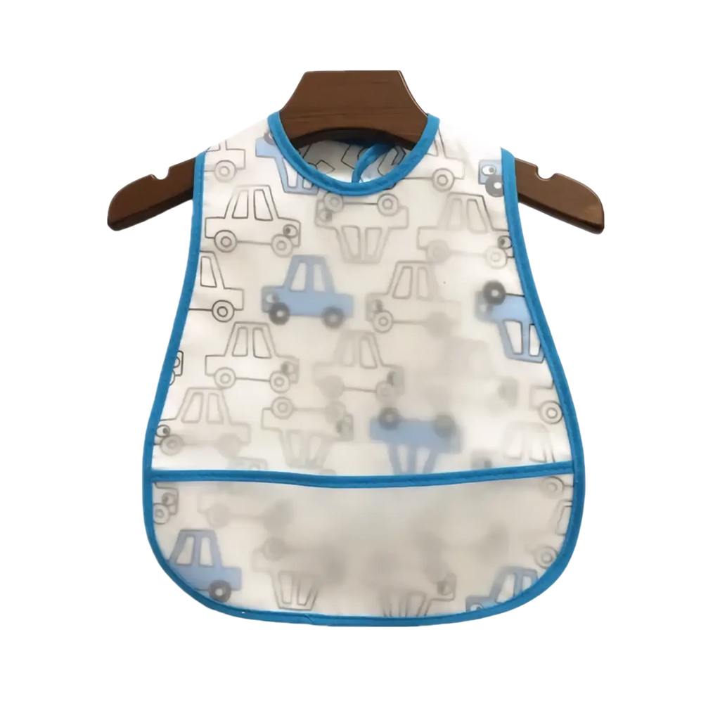 White waterproof eva baby bib with blue trim and cartoon car pattern hanging on wooden hanger for feeding use