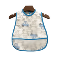 White waterproof eva baby bib with blue trim and cartoon car pattern hanging on wooden hanger for feeding use