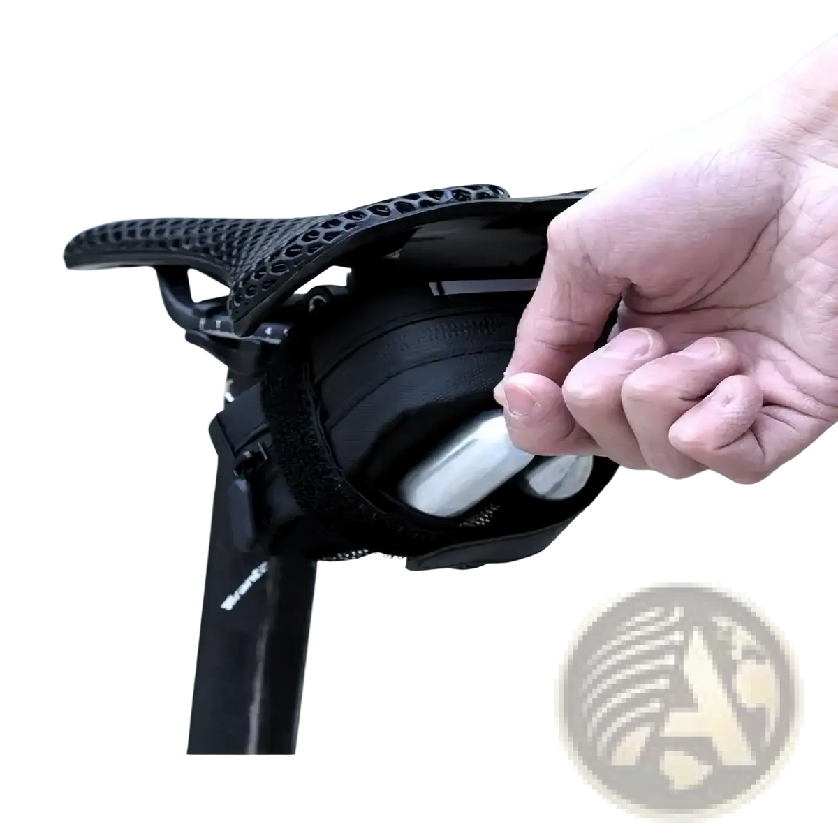 Black mesh waterproof bicycle saddle bag with zippered compartment storing two silver repair tool cylinders