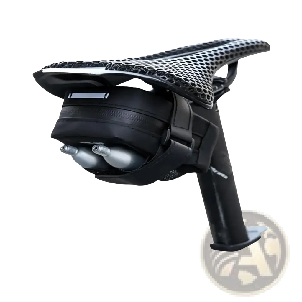 Black perforated bicycle saddle with waterproof rear-mounted saddle bag holding two silver co2 cartridges backside view