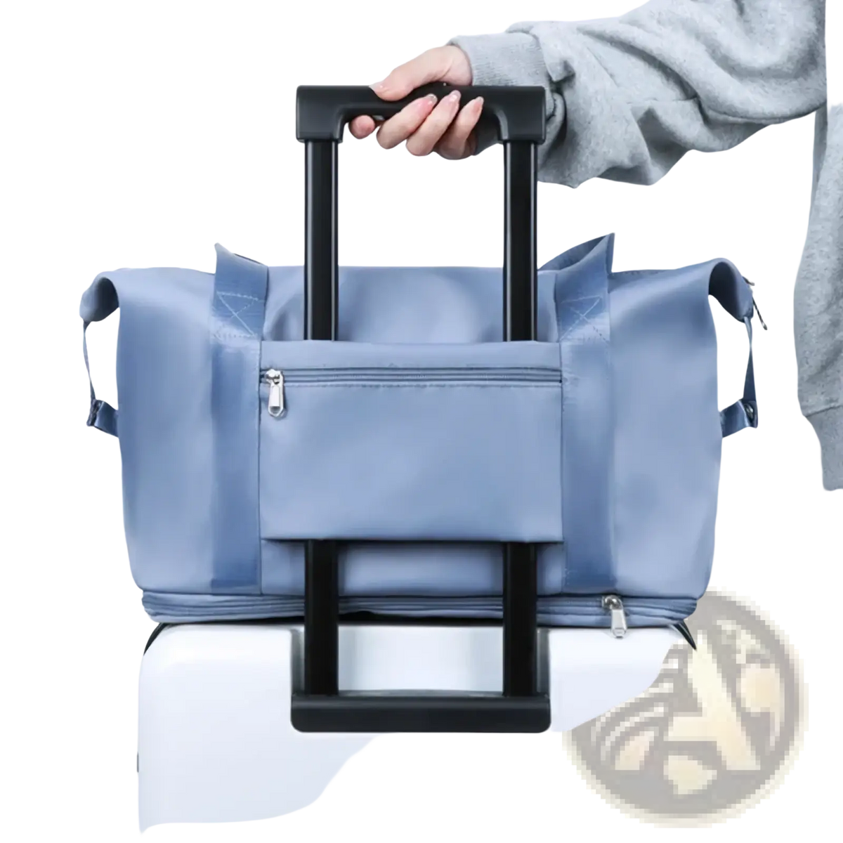 Light blue lightweight nylon waterproof foldable travel duffel bag with black retractable handle and front zippered pocket