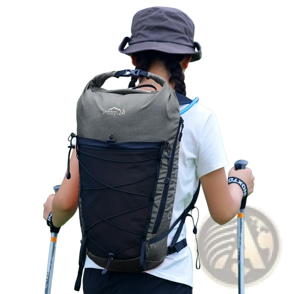Olive green and black waterproof hiking backpack with grid-patterned upper section and adjustable straps shown from the back side