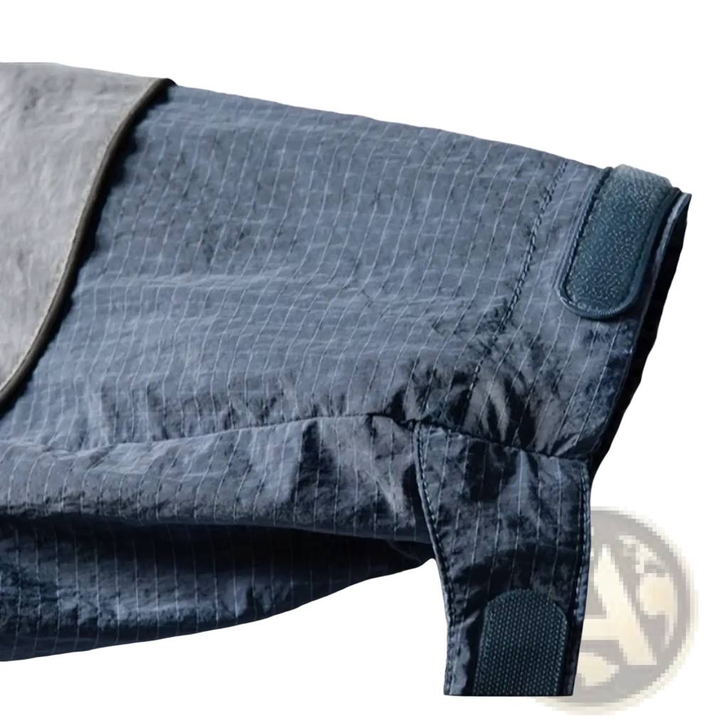 Dark blue quilted waterproof hooded trench coat for men with subtle grid pattern and reinforced elasticated straps