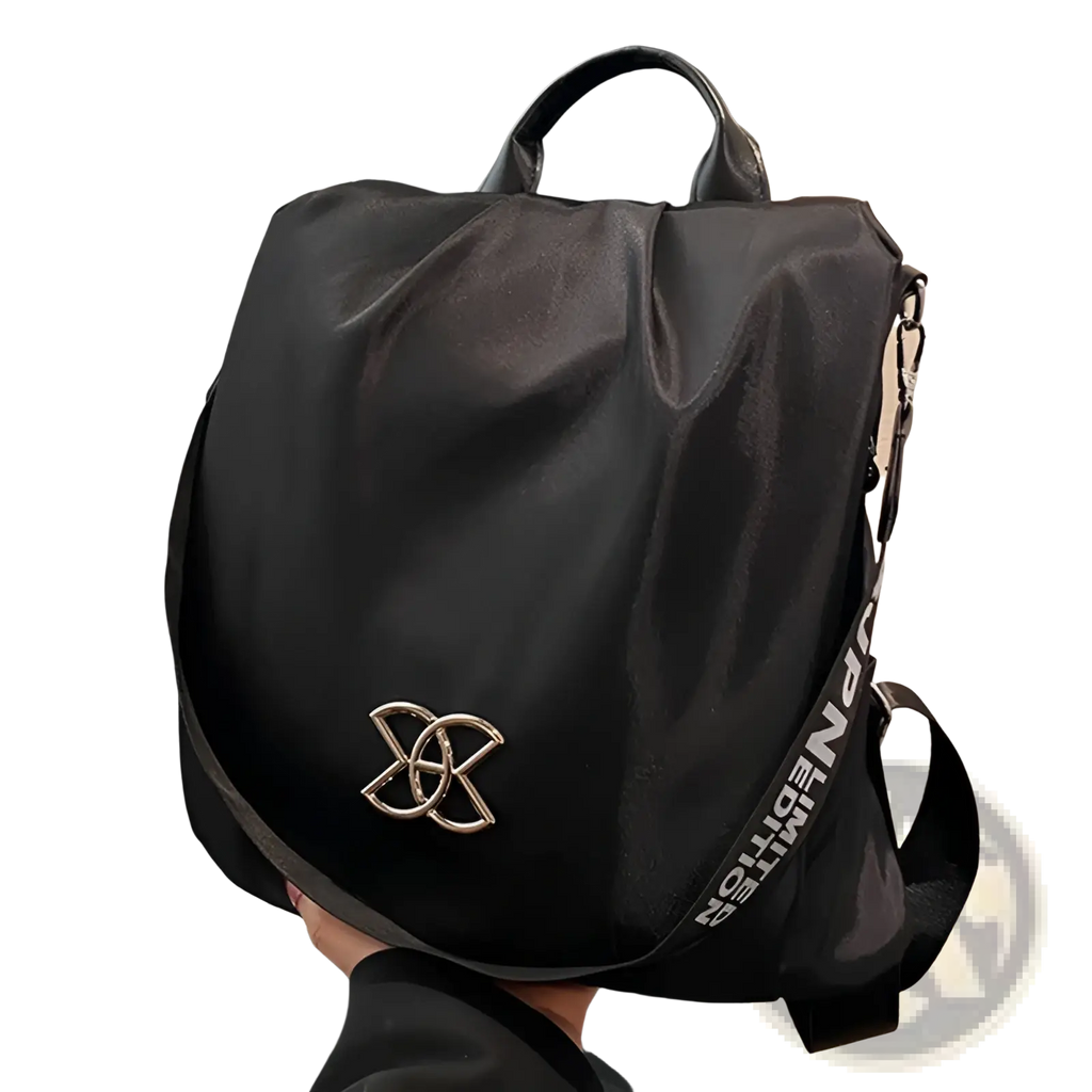 Black nylon waterproof travel backpack with pu leather trim featuring metallic gold logo and white text strap