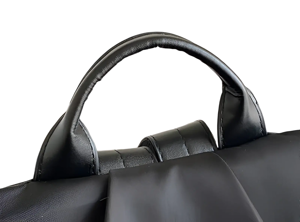Black leather handle with stitched edges and padded grip on a waterproof large capacity nylon travel backpack with pu leather trim