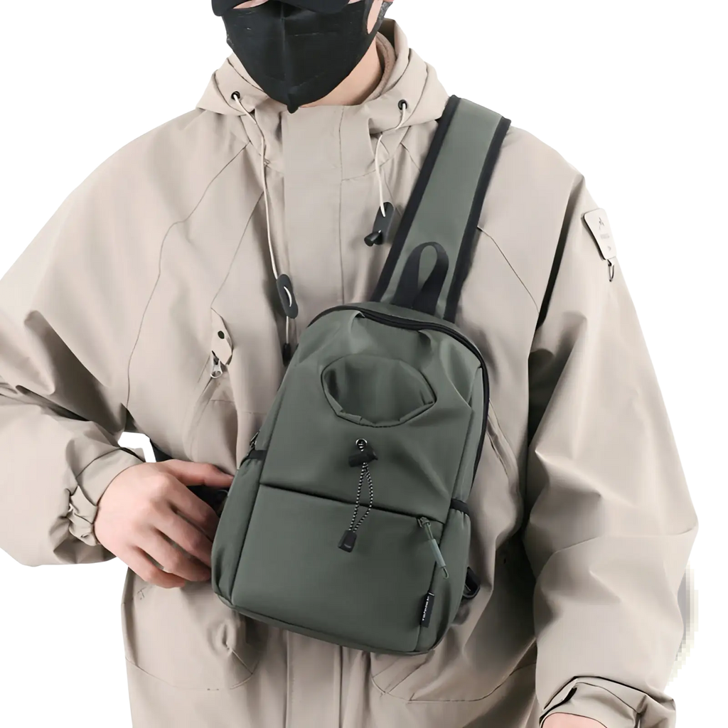 Olive green waterproof men’s oxford cloth minimalist crossbody chest bag with black trim and multiple zippered compartments