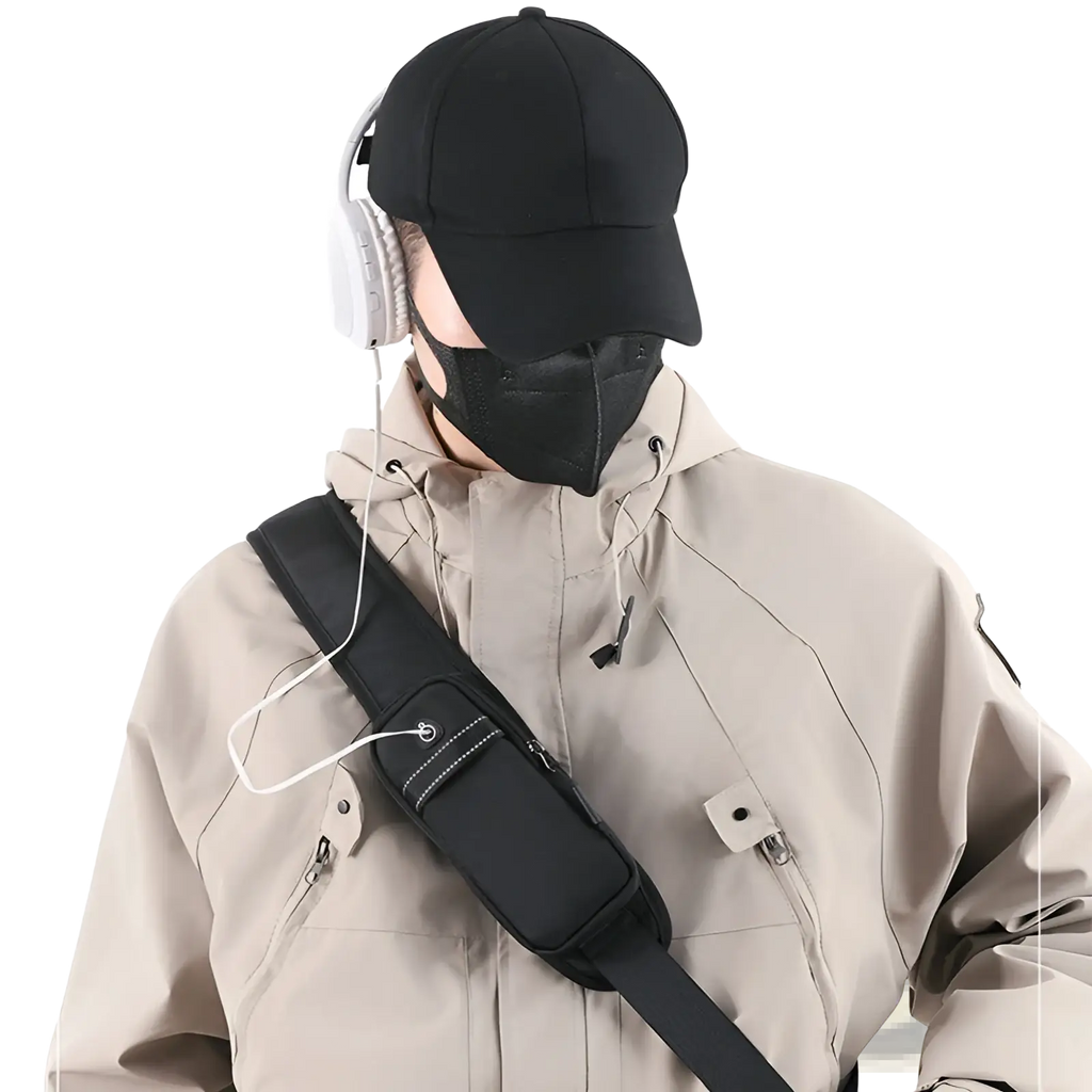 Black nylon waterproof men’s oxford cloth minimalist crossbody chest bag with white stitching and zipper details