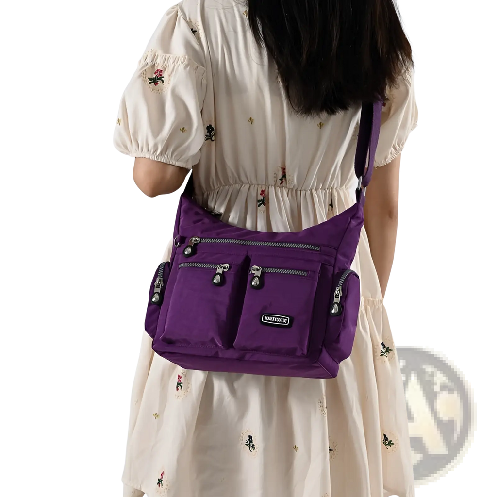 Purple waterproof nylon crossbody shoulder bag with multiple zippered compartments and silver-toned zippers