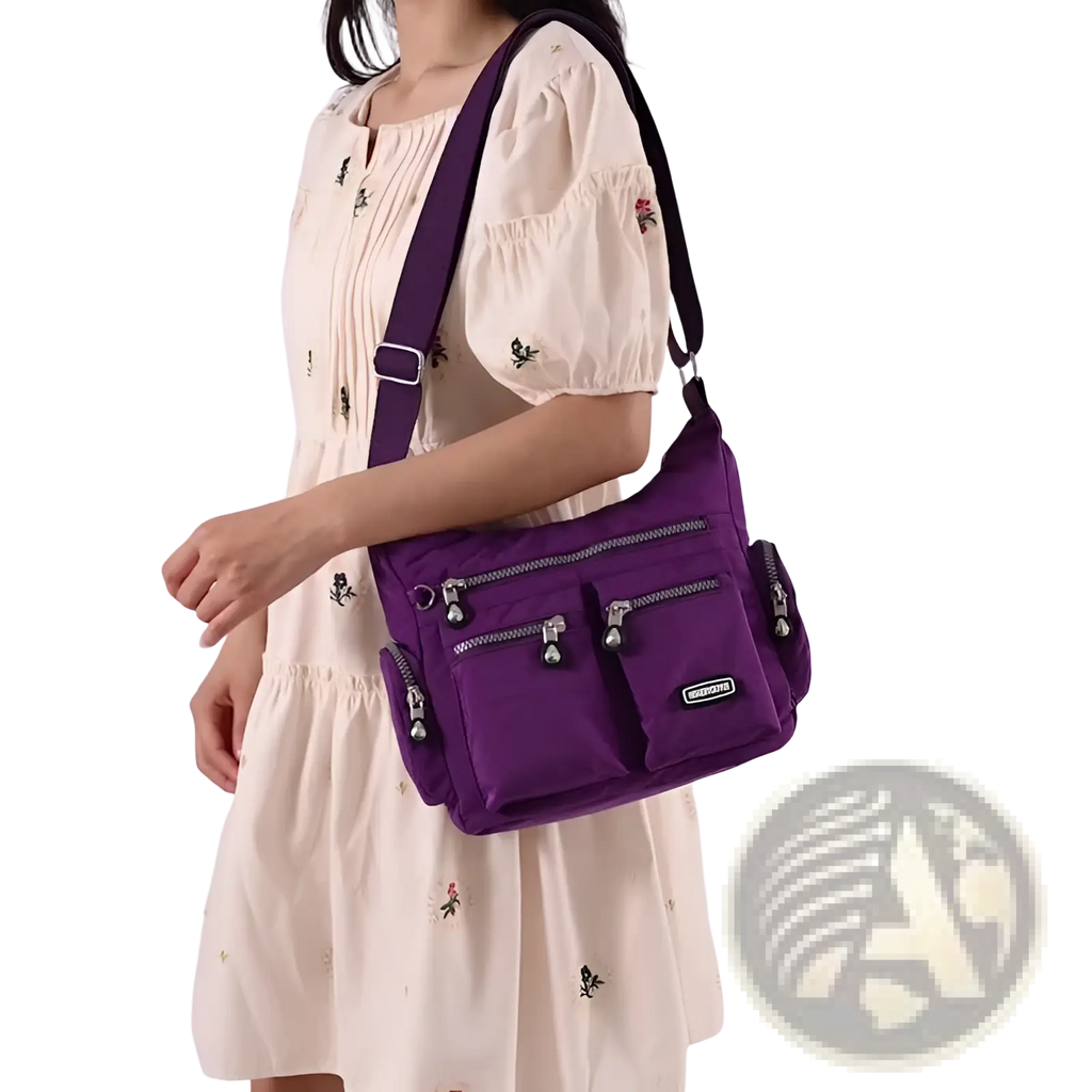 Purple waterproof nylon crossbody shoulder bag with multiple zippered compartments and silver toned hardware