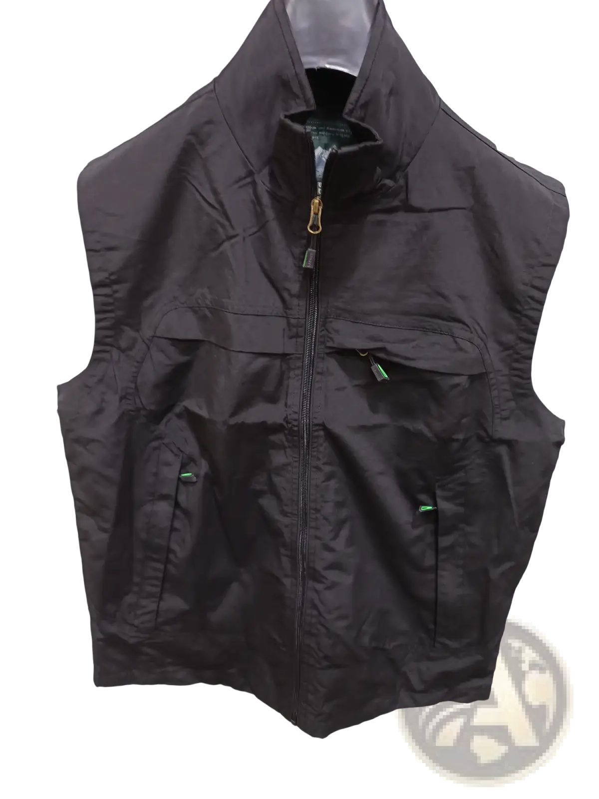Black nylon waterproof multi pocket utility vest with central and green accented zippers for outdoor use