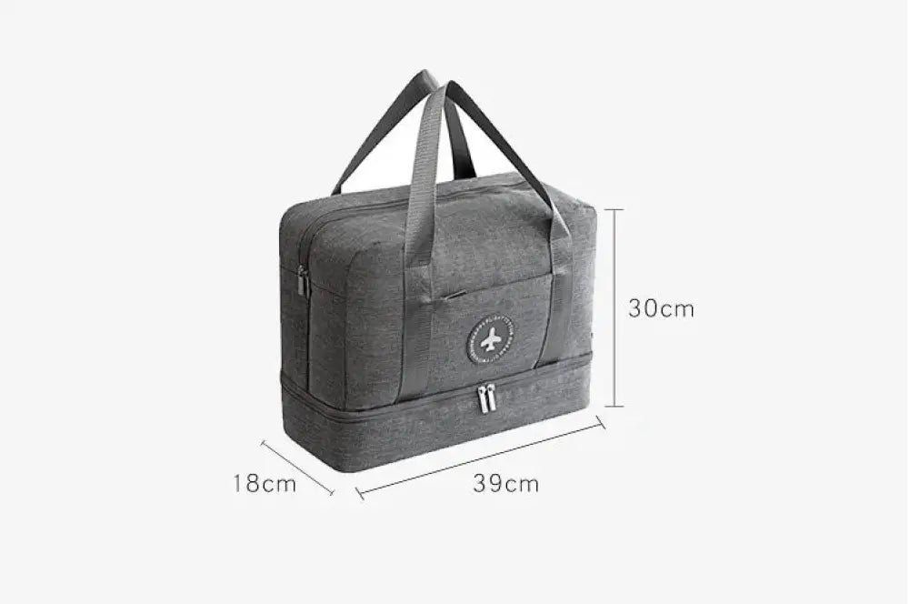 Gray textured waterproof travel shoe bag with reinforced dual handles and circular logo patch