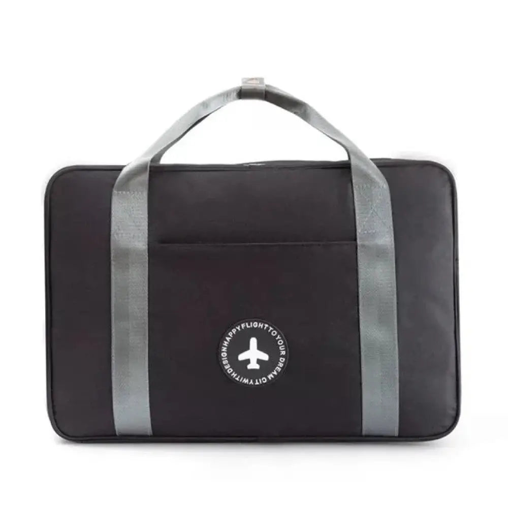 Black waterproof dream travel shoe bag with gray reinforced handles and circular white airplane logo