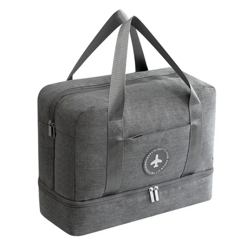 Gray textured fabric waterproof travel duffel bag with dual zippers and circular logo patch for shoe storage