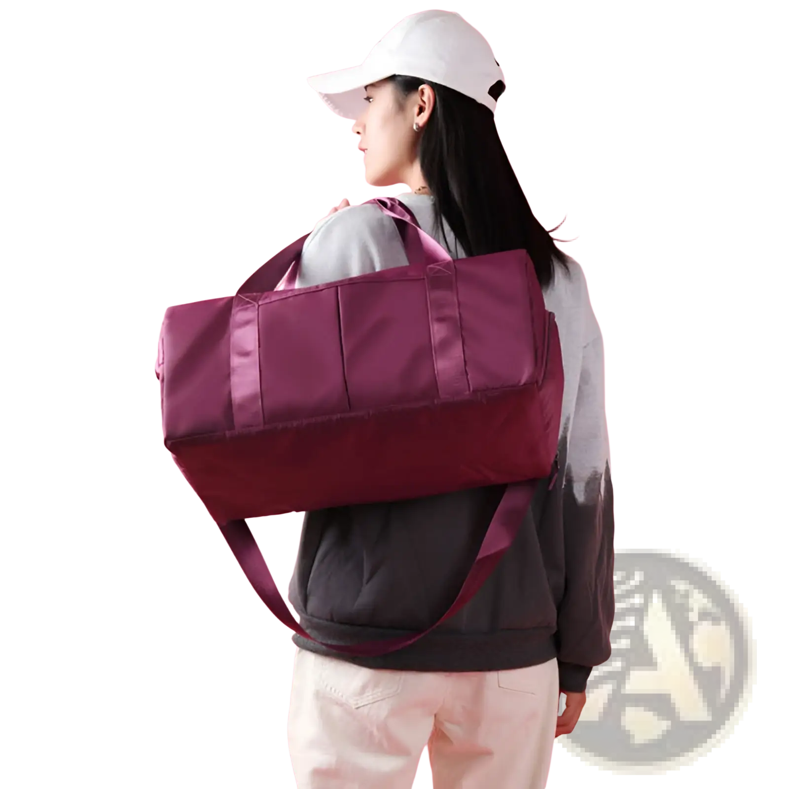 A sleek two-toned purple and maroon waterproof oxford travel duffel bag with reinforced handles and detachable strap