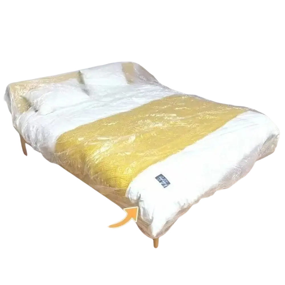 Waterproof clear plastic furniture dust cover over yellow and white patterned bedspread for protection against dust