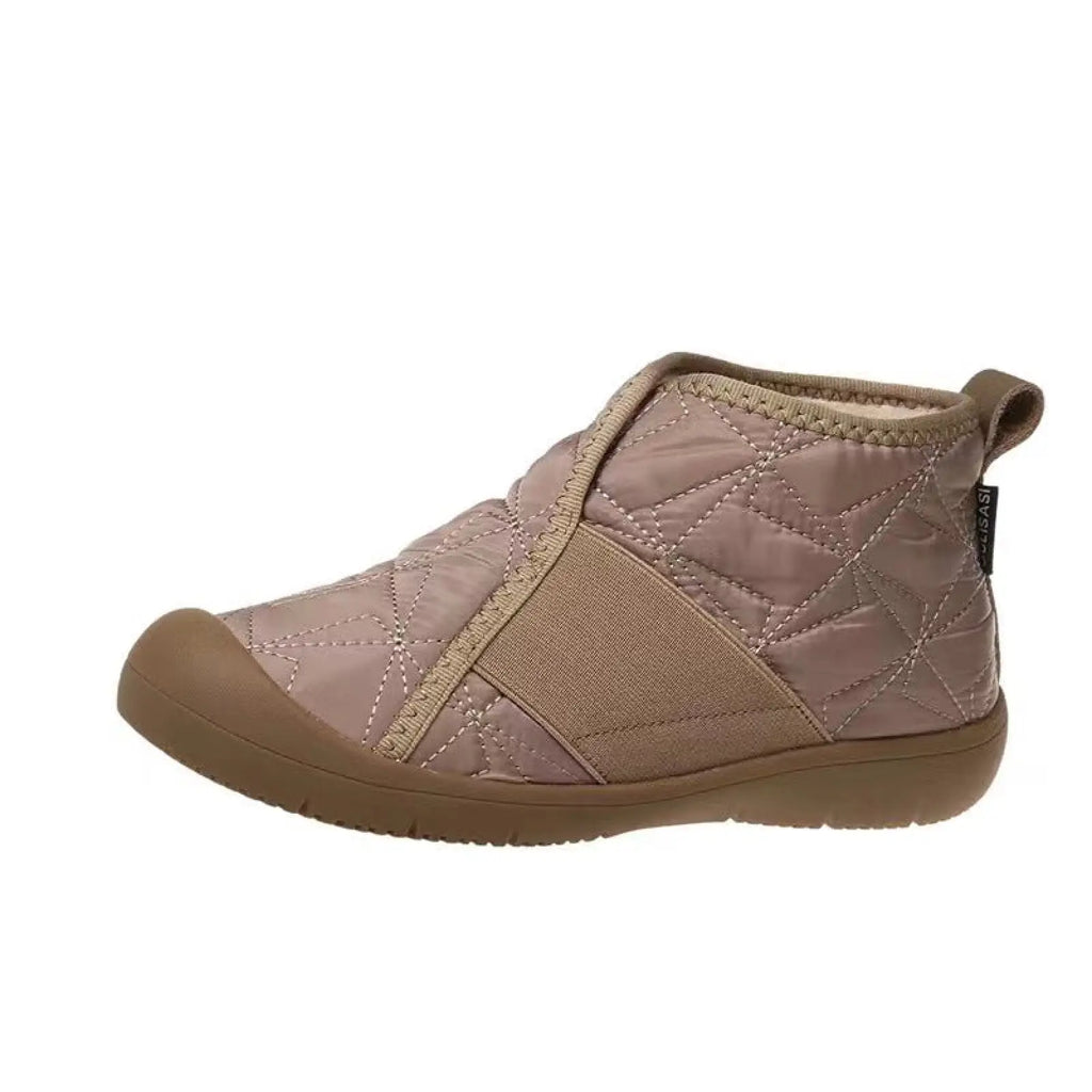 Beige quilted waterproof plush winter snow ankle boot with tan rubber sole and elastic side panel for cold weather