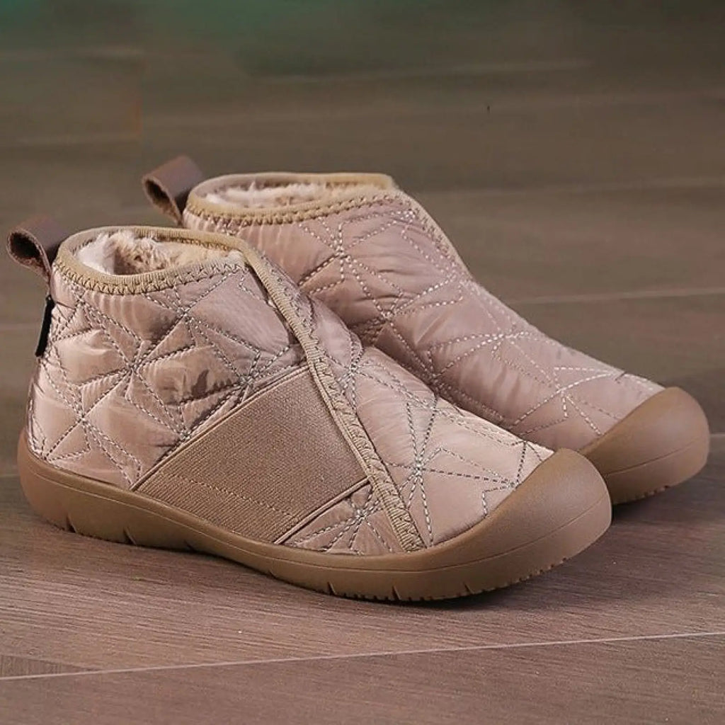 Beige waterproof plush winter snow boots with quilted exterior fleece lining and elastic side panels for warmth and comfort