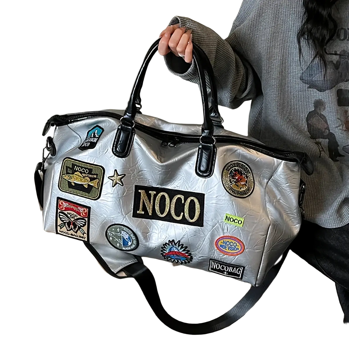 Silver metallic waterproof PU leather travel duffle bag with black leather handles and colorful noco embroidered patches
