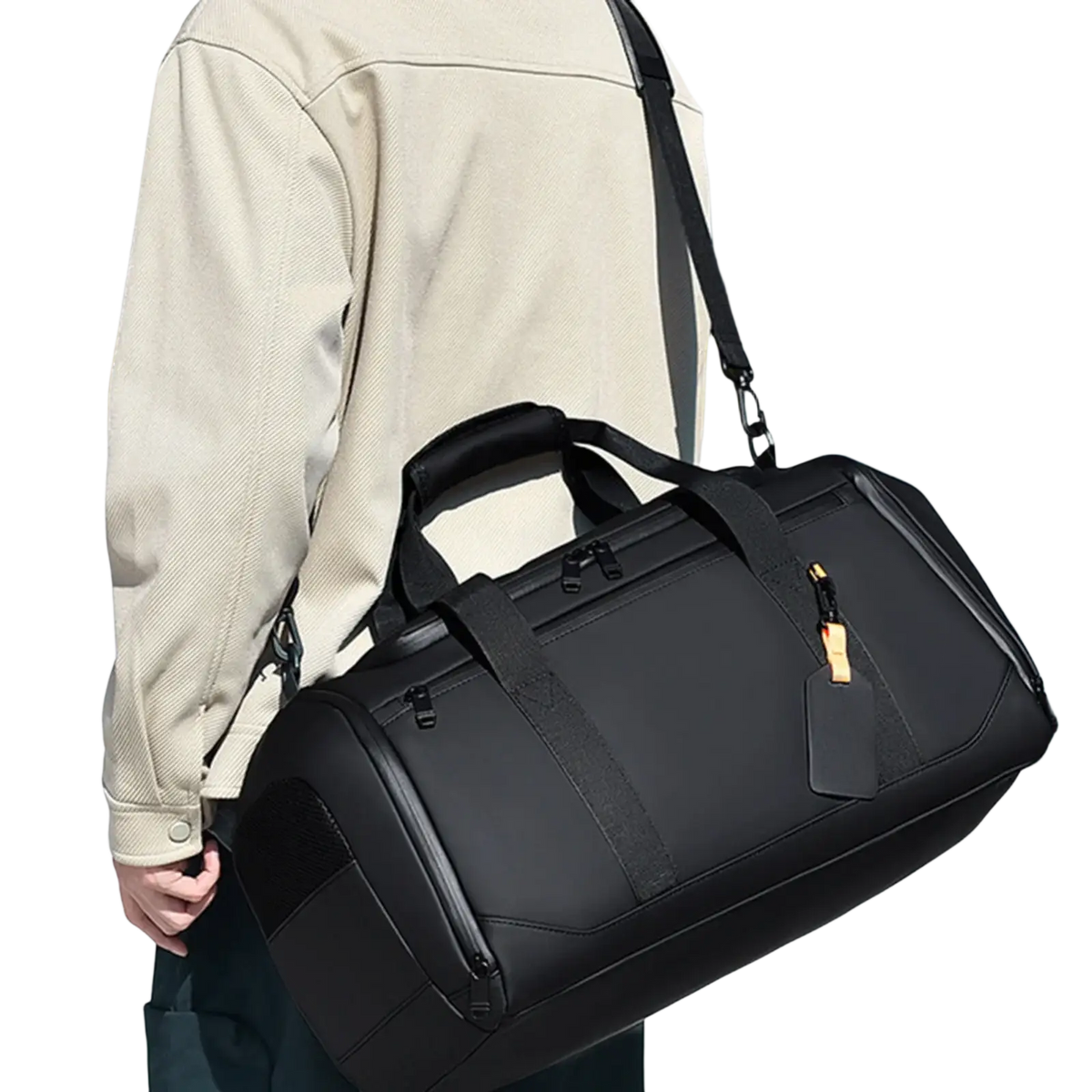 Black waterproof travel duffle bag with reinforced straps and gold-tone zipper pull for large capacity gym organization