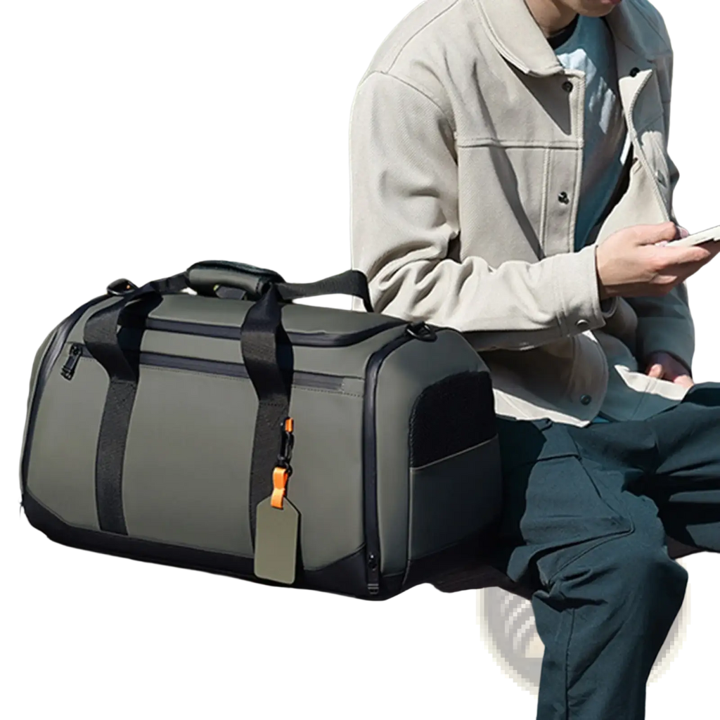 Olive green and black waterproof travel duffle bag with large capacity reinforced straps and bright orange tag