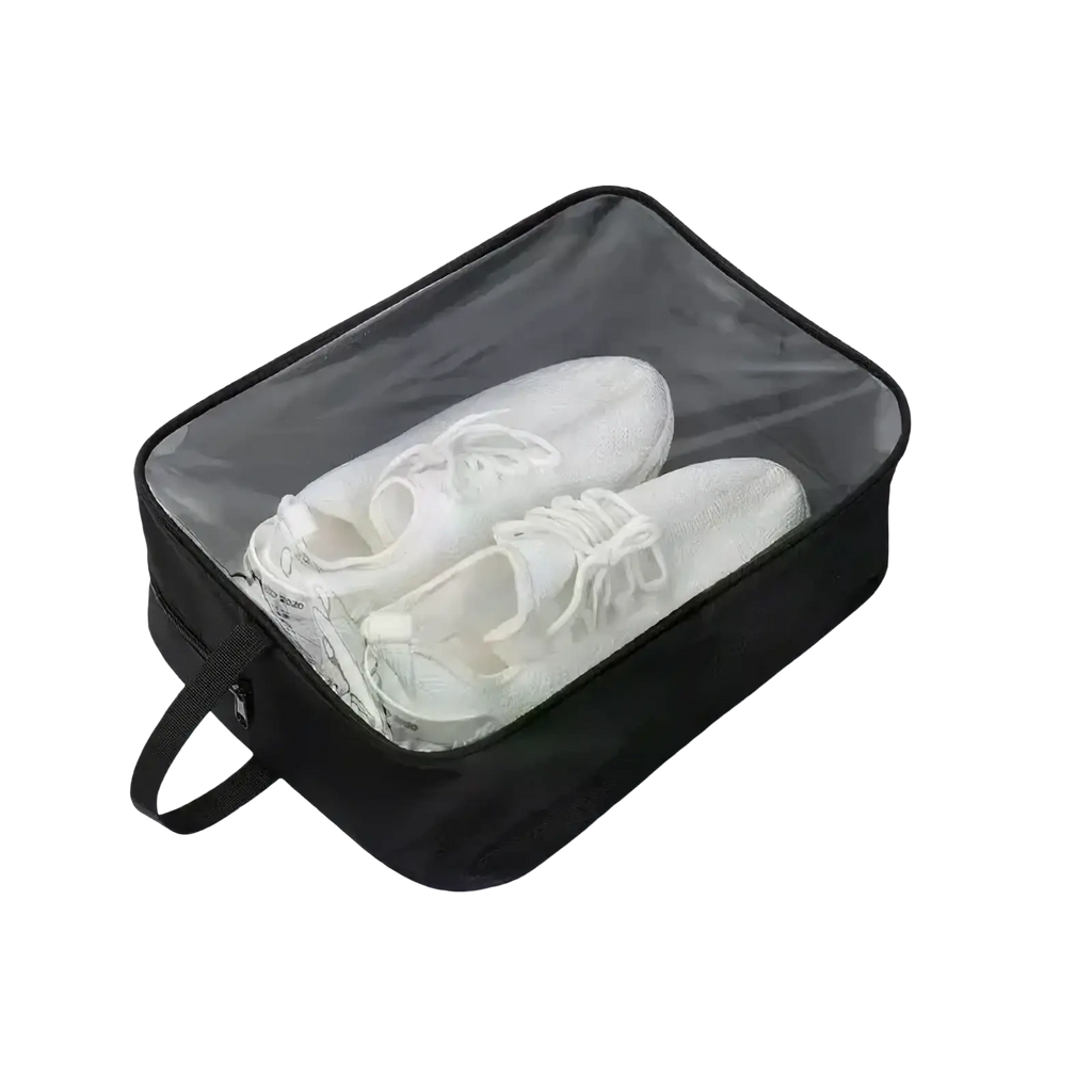 Black waterproof travel shoe bag with transparent front panel, handle, and zipper for storing one pair of white sneakers